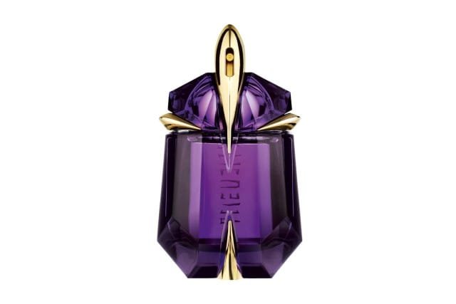 A purple bottle of 'Alien the Fragrance' perfume, featuring elegant gold accents.