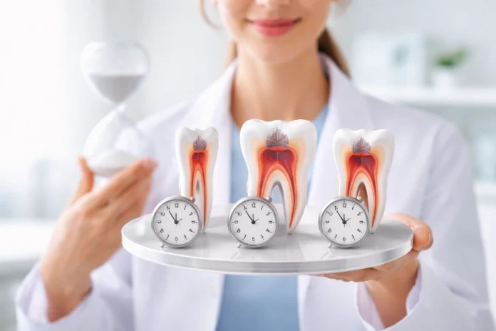 Dentist performing root canal treatment to show how long does a root canal take for front, molar, and back teeth